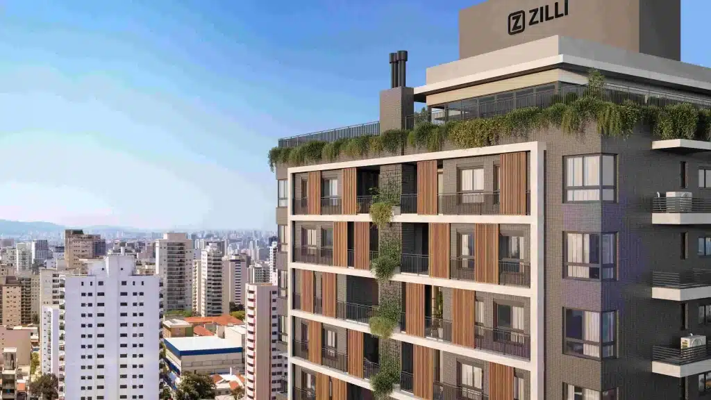 Vista aérea do bairro Campinas em São José, destacando sua urbanização densa, edifícios residenciais e comerciais, proximidade com o mar e montanhas ao fundo.